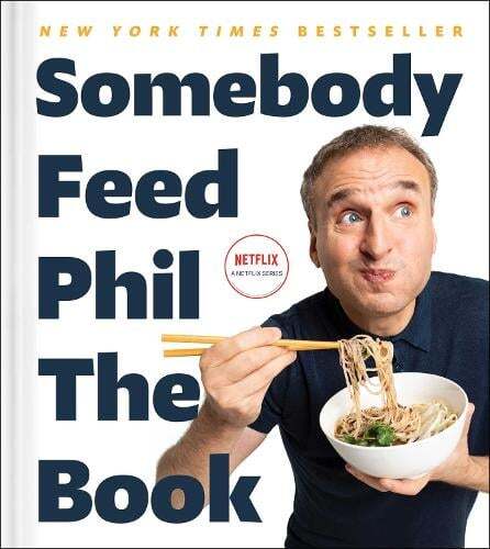 This is the book cover for 'Somebody Feed Phil the Book' by Phil Rosenthal