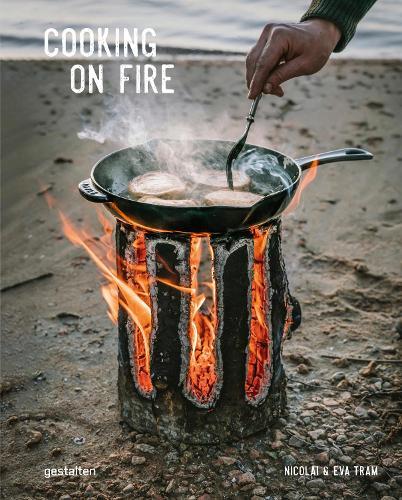 This is the book cover for 'Cooking on Fire' by Eva Helbaek Tram